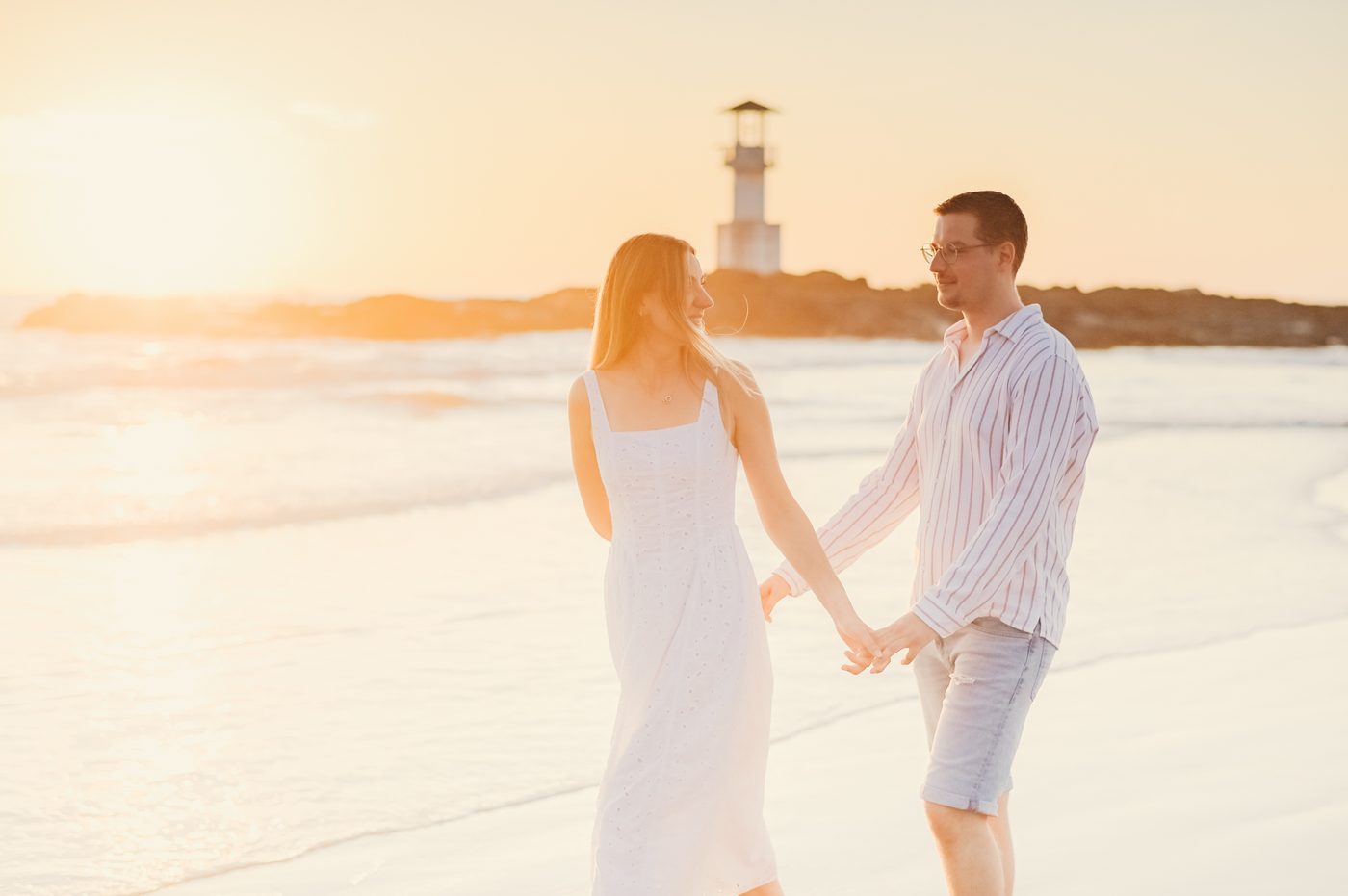 Couple at golden hour near a lighthouse in Khao Lak