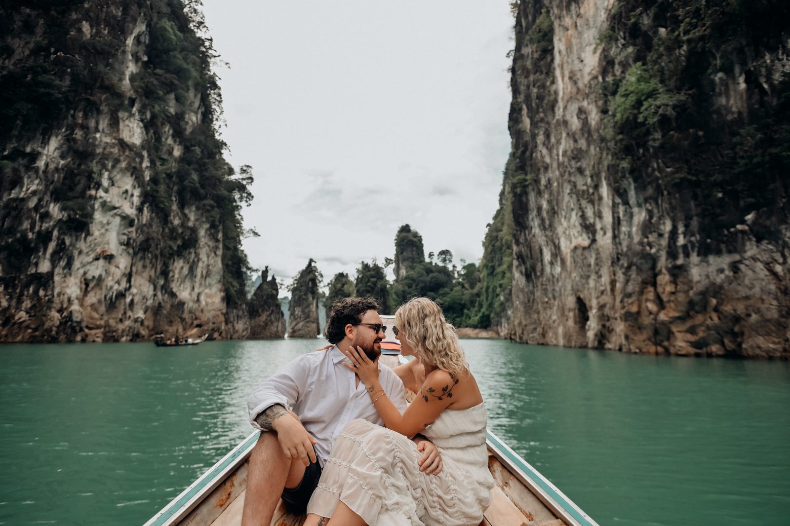 Couple photoshoot by longtail boat at Cheow Lan Lake, Khao Sok